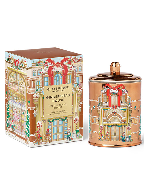 Gingerbread house-themed candle and packaging on a white background