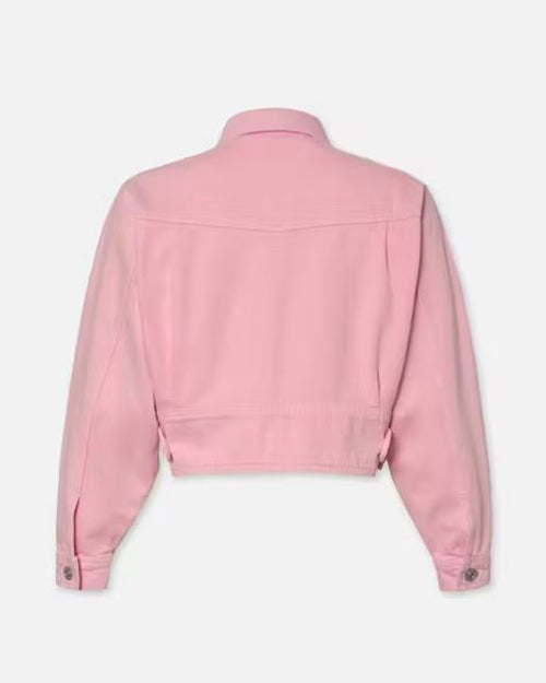 A back view of a denim pink jacket with a high collar and long sleeves. The jacket has denim smooth texture, with visible stitching lines along the shoulders, arms, and back hem. There are silver button details on the cuffs of the sleeves and a horizontal seam across the lower back.