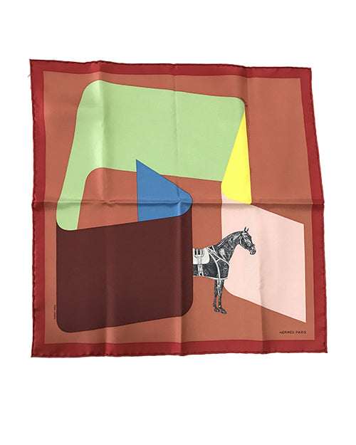 Silk scarf with abstract art with geometric shapes and a horse. Main color is  a brown/marron color with shapes in green, blue, and yellow that create a sense of three-dimensional space. A detailed drawing of a horse with patterns on its body is positioned at the intersection of these shapes.