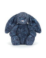 Blue plush bunny toy on a white background