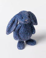 Blue textured plush bunny toy on a white background