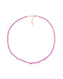 A delicate pink beaded necklace with a rose gold clasp and adjustable chain, featuring a small rose gold accent at the center. The design is simple and elegant.