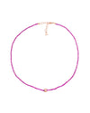 A delicate pink beaded necklace with a rose gold clasp and adjustable chain, featuring a small rose gold accent at the center. The design is simple and elegant.