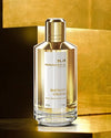 Mancera Instant Crush perfume bottle on a gold background