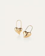 Two gold heart-shaped earrings 