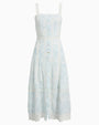 A complete image of a light blue and white dress with buttoning down the front and over the shoulder straps. The dress has lace detailing and a fitted bodice that flares out into an A-line skirt. 