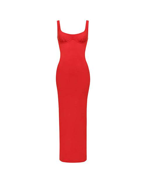 A long, form-fitting red dress with a scoop neck and thin straps. There is seam-work distinguishing the bust area and the torso down area of the dress.