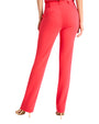 Back view of model wearing red pants with nude heels. Image only shows from waist down.