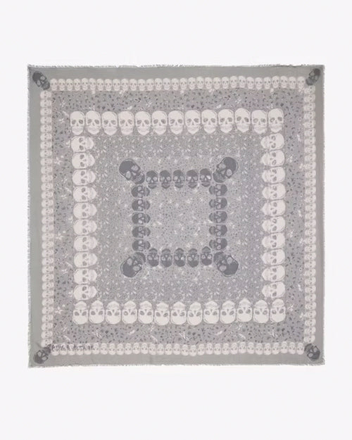 Square pattern scarf featuring concentric rows of skulls in alternating white and gray colors, creating a layered and symmetrical design