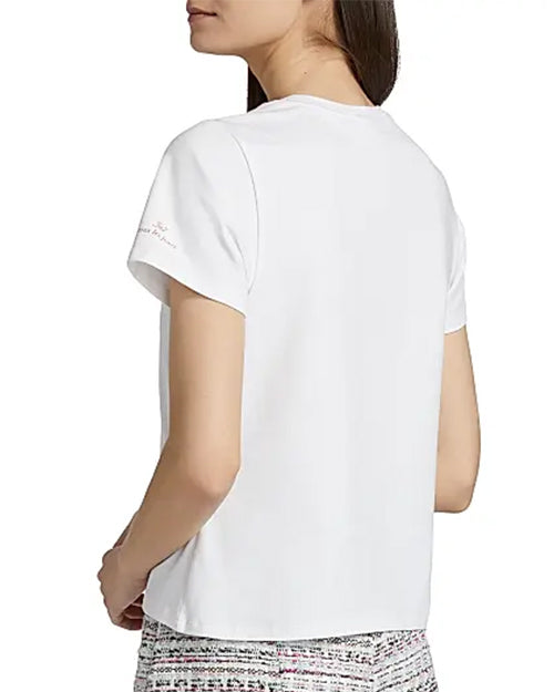 Back view of a person wearing a white t-shirt on a white background