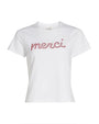 White t-shirt with 'merci' text on a white background