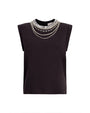 Black sleeveless top with decorative neckline on a white background