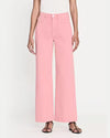 A model wearing high-waisted pink denim trousers with a straight cut fit and raw hem paired with a white top. The model styles the pants with black open-toe sandals.