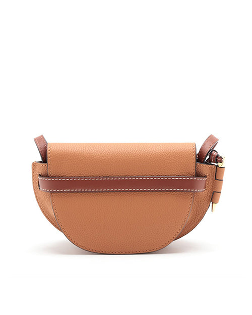 back view of Loewe tan bag with a strap across bag featuring  visible white stitching.