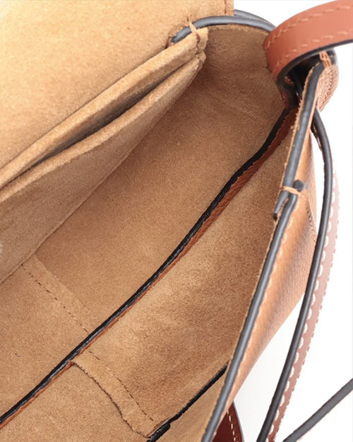 Inside Loewe bag features a light brown suede color.  