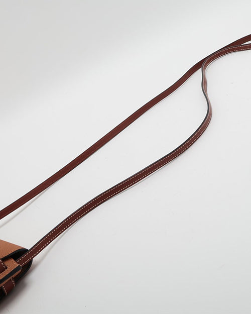 Brown leather strap of Loewe's bag.