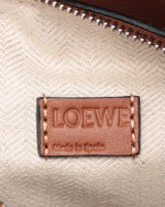 Close up on the inside tag of Loewe tag. Loewe made in Spain is embossed on the leather tag.