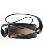 An upper-view of a black cross-body bag with gold hardware and tan interior.