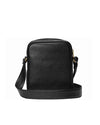 Back view of a black leather crossbody bag with a pebbled texture. The bag has a rounded rectangular shape and features a gold-toned zipper closure at the top. It includes an adjustable strap attached with gold-toned hardware.