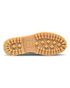 Close-up of a tan sole with brand logo on a white background