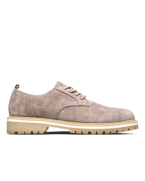 Beige suede shoe on a white background