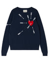 A navy-blue sweater with a design of white arrows and a red heart. The arrows are pointing towards the heart, which is located on the left side of the chest area. There is also a label at the neckline that reads "jumper 1234".
