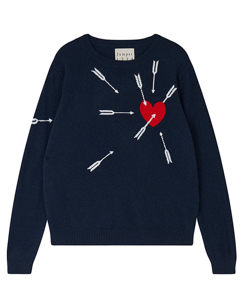 A navy-blue sweater with a design of white arrows and a red heart. The arrows are pointing towards the heart, which is located on the left side of the chest area. There is also a label at the neckline that reads "jumper 1234".