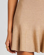 Close up of metallic gold knit dress.