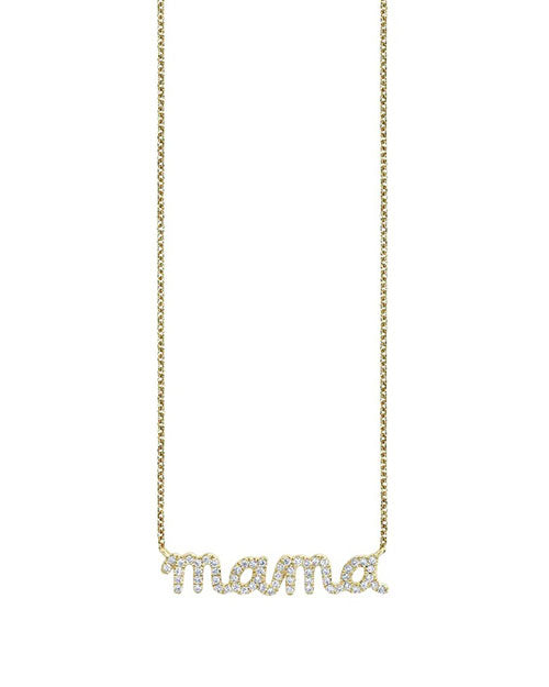 A gold necklace with the word ‘mama’ formed in a cursive script, adorned with pave diamonds.