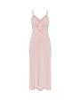 Pink slip dress with a lace bow on a white background