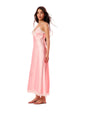 Side view of a woman wearing a pink satin slip dress on a light background