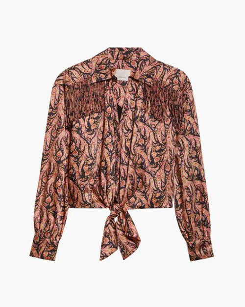 Women's long-sleeve paisley blouse in pink, orange, and black with a collared neckline, button-down front, tie-front hem, and frindge details on white background