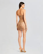 A back view of a tan lace mini dress. The dress features a strapless, silver zipper down the back with boning detail throughout. The dress has oversized ties at each side, with a classy sheer design.