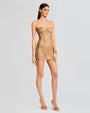 A side view a tan lace mini dress. The dress features a strapless, sweetheart corset bodice with boning detail throughout. The dress has oversized ties at each side, with a classy sheer design.