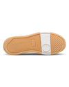 Close-up of a shoe sole with a white and brown design on a white background