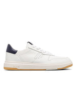 Side view of a white sneaker with a blue heel tab on a white background
