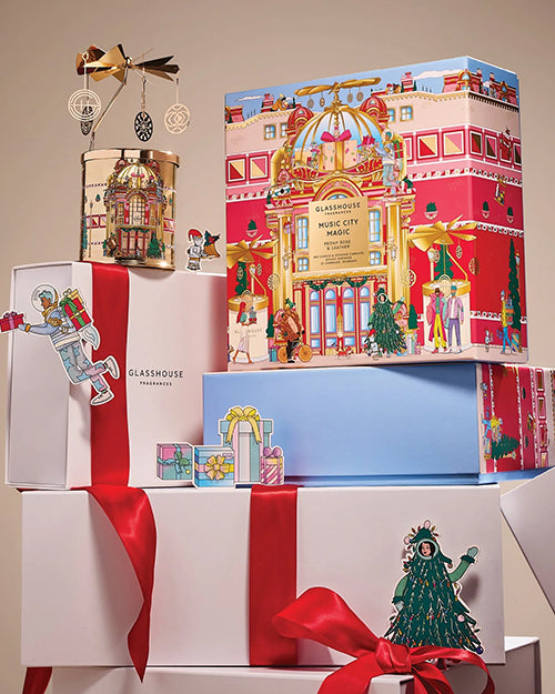 Decorative gift boxes with festive designs and Christmas-themed elements on a beige background.