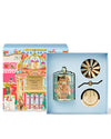 Decorative candle set with colorful packaging on a white background