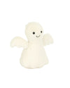 Small white plush angel toy with two wings, black button eyes, and a stitched smile.