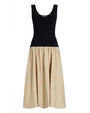 Two-tone black and beige dress on a white background