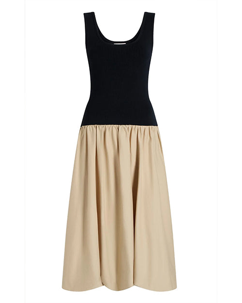 Two-tone black and beige dress on a white background