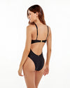 A back view of a black one piece swimsuit with a cut out, gold clasp and adjustable straps.