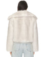 Back view of a light gray faux fur jacket featuring a wide collar and a soft, plush texture, paired with light wash denim jeans.