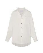 Linen oversized dress shirt in white on a white background.