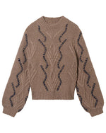 Brown knitted sweater with ribbed collar, cuffs, and hem, featuring vertical wavy lines and leaf-like patterns in darker thread along the front and sleeves.