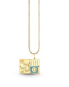 A gold necklace with a pendant designed to resemble an open passport. The left side of the pendant features engraved iconic city names such as “Paris,” “Tokyo,” and “New York". The right side displays vertical lines mimicking the pages of a passport, with a circular stamp-like design in the center. The charm conveys a theme of travel and adventure.