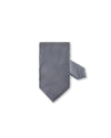 A necktie with an intricate black and white zigzag pattern displayed against a plain white background.