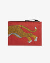 The back view of a rectangular pouch with a vibrant red background. It features a detailed illustration of a Mykonos leopard. The zipper of the pouch is at the top and black. 