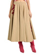 Beige skirt with red floral embroidery and red high-heeled boots on a white background