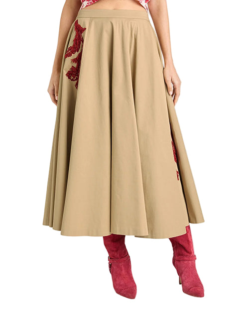 Beige skirt with red floral embroidery and red high-heeled boots on a white background